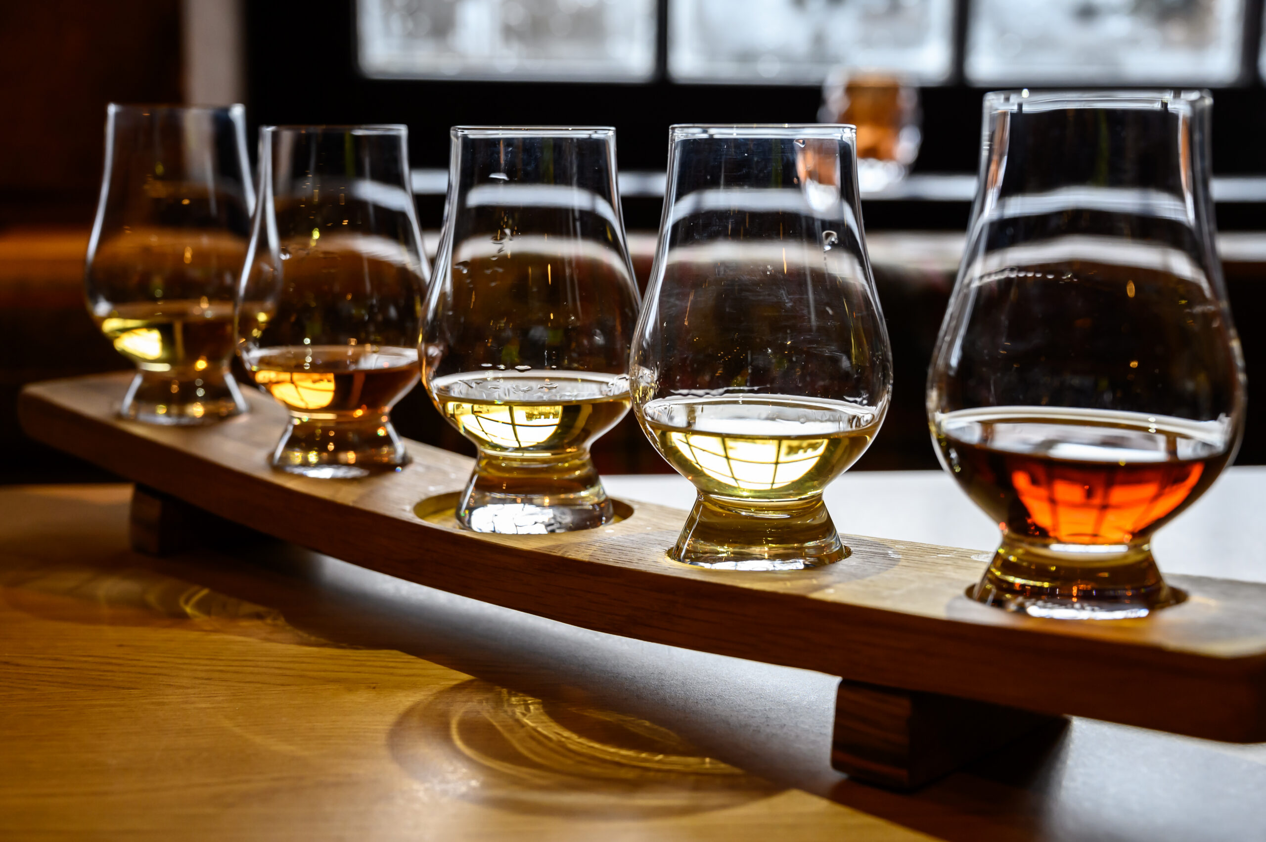 Scotch whisky, tasting glasses with variety of single malts or blended whiskey
